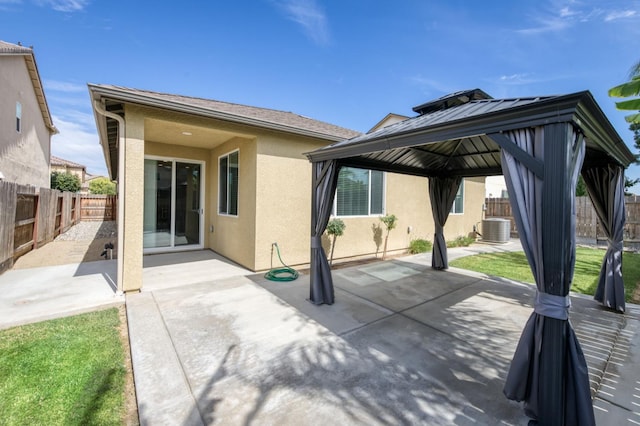 7173 N Shiraz, Fresno, CA 93722 - rear view of property with a gazebo, stucco siding, a patio area, and a fenced backyard