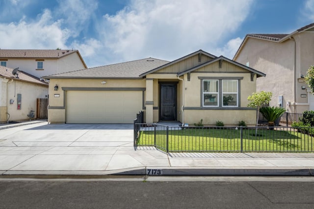 7173 N Shiraz, Fresno, CA 93722 - view of front facade featuring a garage, driveway, and stucco siding
