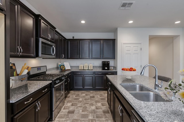 7173 N Shiraz, Fresno, CA 93722 - kitchen with stainless steel appliances, light stone countertops, and recessed lighting