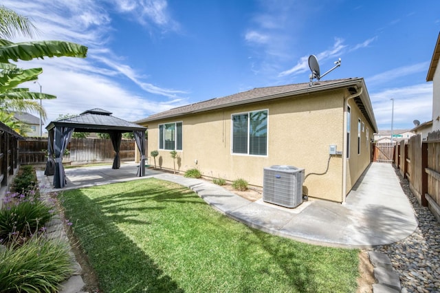 7173 N Shiraz, Fresno, CA 93722 - back of house with a gazebo, a patio, stucco siding, and a fenced backyard