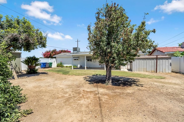 8573 E Ostler St, Selma, CA 93662 - rear view of house featuring a patio area
