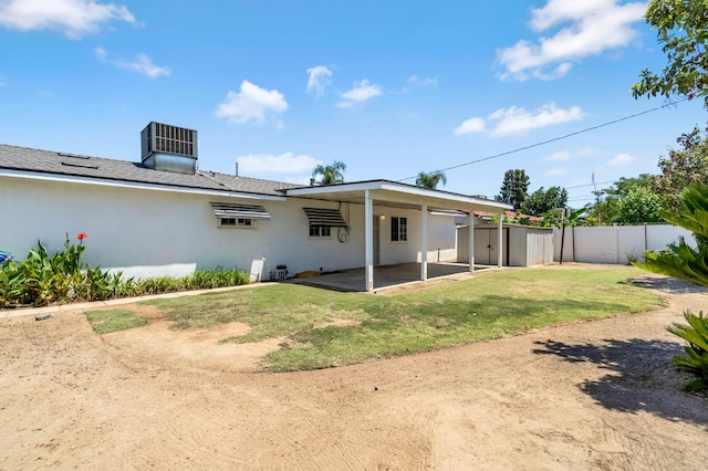 8573 E Ostler St, Selma, CA 93662 - rear view of house featuring stucco siding and a patio area