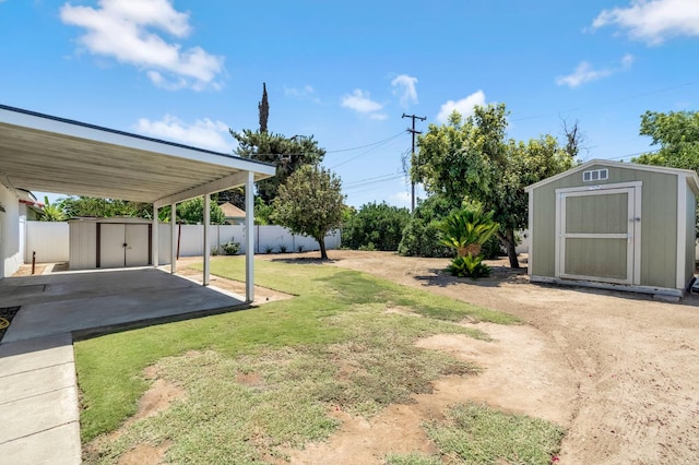 8573 E Ostler St, Selma, CA 93662 - view of yard with a storage shed and a patio