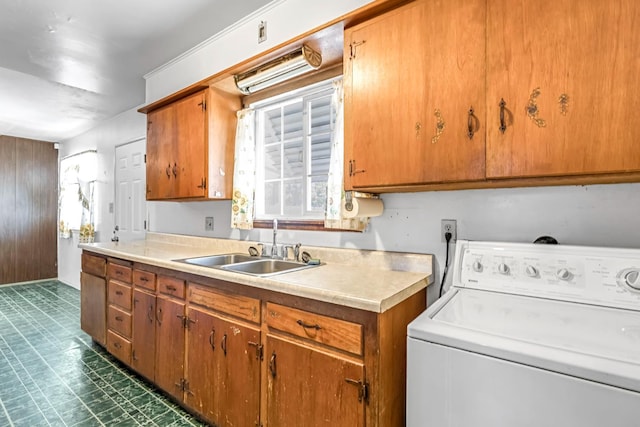 8573 E Ostler St, Selma, CA 93662 - laundry room with washer / dryer, cabinet space, and dark floors