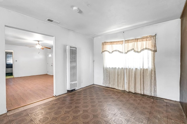 8573 E Ostler St, Selma, CA 93662 - empty room with a heating unit, a smoke detector, and a ceiling fan