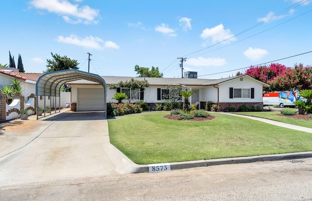 8573 E Ostler St, Selma, CA 93662 - ranch-style house with a garage, a front yard, stucco siding, brick siding, and driveway