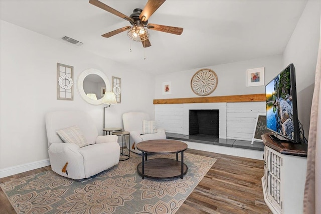 27762 Twin Ponds Rd, Clovis, CA 93619 - sitting room featuring wood finished floors, ceiling fan, and a brick fireplace