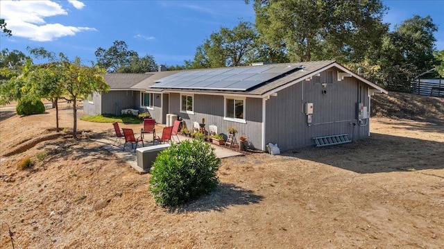 27762 Twin Ponds Rd, Clovis, CA 93619 - rear view of property with roof mounted solar panels and a patio