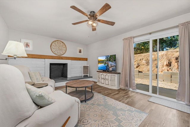 27762 Twin Ponds Rd, Clovis, CA 93619 - living area featuring wood finished floors, a ceiling fan, and a fireplace