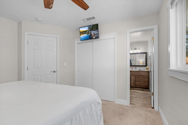 27762 Twin Ponds Rd, Clovis, CA 93619 - carpeted bedroom with a closet, connected bathroom, and ceiling fan