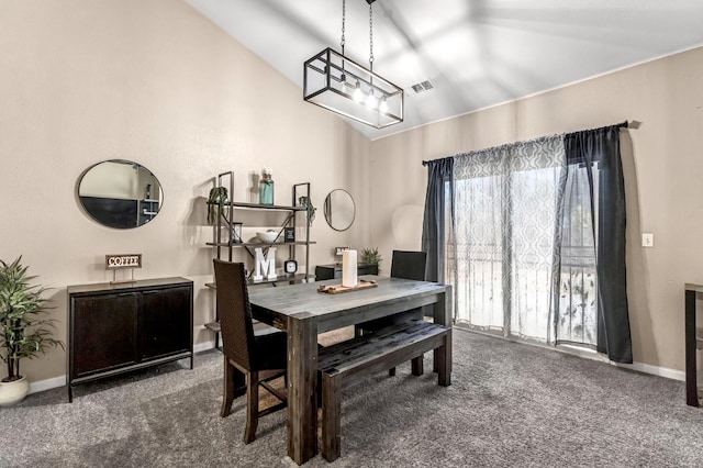3615 W Michigan Ave, Fresno, CA 93722 - carpeted dining room with baseboards and lofted ceiling