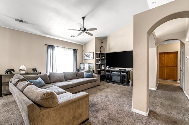 3615 W Michigan Ave, Fresno, CA 93722 - carpeted living area featuring ceiling fan, arched walkways, and vaulted ceiling