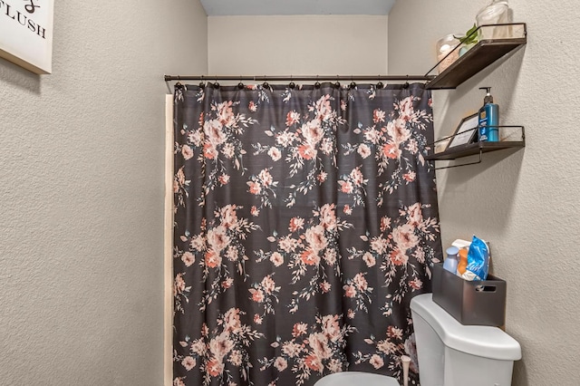 3615 W Michigan Ave, Fresno, CA 93722 - bathroom with a textured wall and a shower with shower curtain