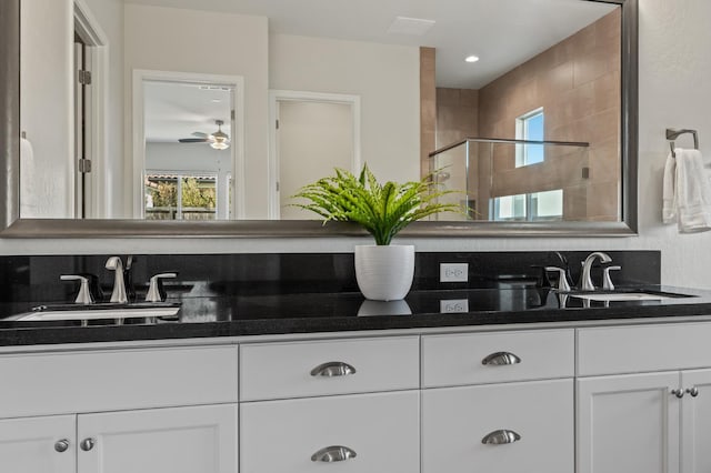 998 Highland Rd W, Madera, CA 93636 - full bath with double vanity, plenty of natural light, tiled shower, and ceiling fan