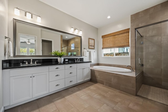 998 Highland Rd W, Madera, CA 93636 - full bath featuring double vanity, a stall shower, a garden tub, and ceiling fan