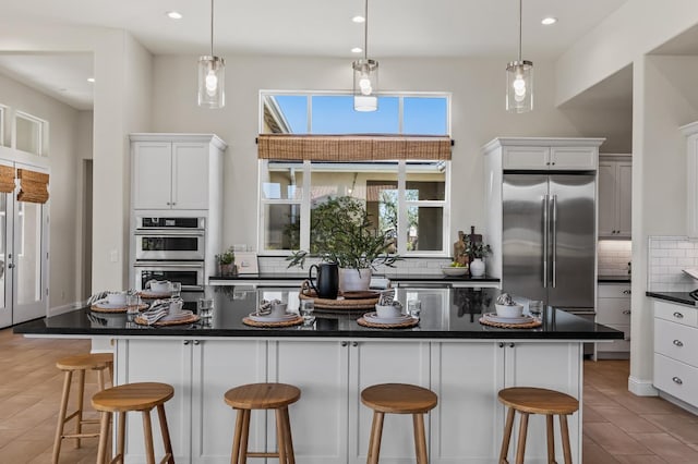 998 Highland Rd W, Madera, CA 93636 - kitchen with appliances with stainless steel finishes, backsplash, dark countertops, recessed lighting, and white cabinets