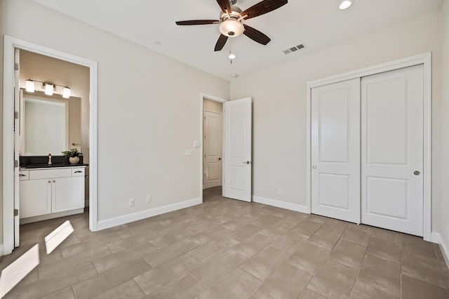 998 Highland Rd W, Madera, CA 93636 - unfurnished bedroom featuring a closet, ensuite bathroom, recessed lighting, and ceiling fan
