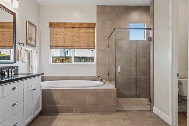 998 Highland Rd W, Madera, CA 93636 - full bathroom featuring a bath, vanity, a stall shower, and tile patterned floors