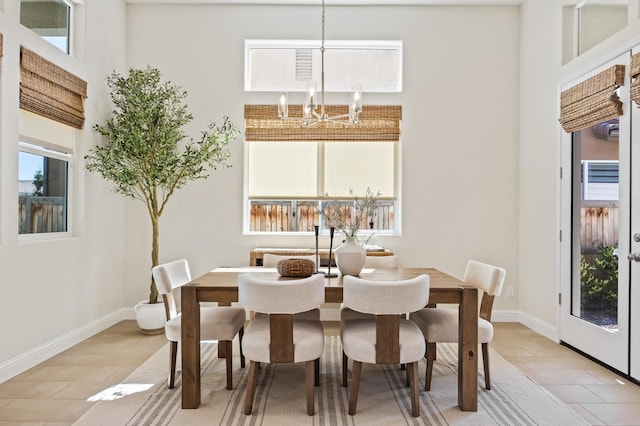 998 Highland Rd W, Madera, CA 93636 - dining room featuring a chandelier and baseboards