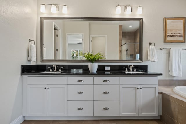 998 Highland Rd W, Madera, CA 93636 - full bathroom with a shower stall, double vanity, and a garden tub