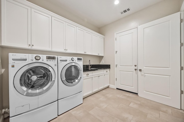 998 Highland Rd W, Madera, CA 93636 - washroom with washer and clothes dryer, cabinet space, and recessed lighting