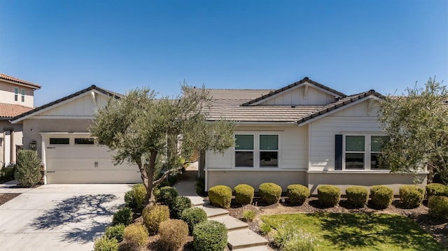 998 Highland Rd W, Madera, CA 93636 - view of front of home with a tile roof, an attached garage, and driveway