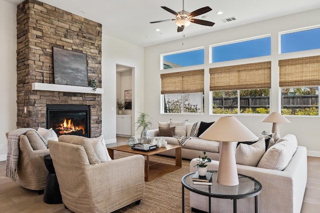 998 Highland Rd W, Madera, CA 93636 - living room with plenty of natural light, a ceiling fan, a stone fireplace, wood finished floors, and recessed lighting