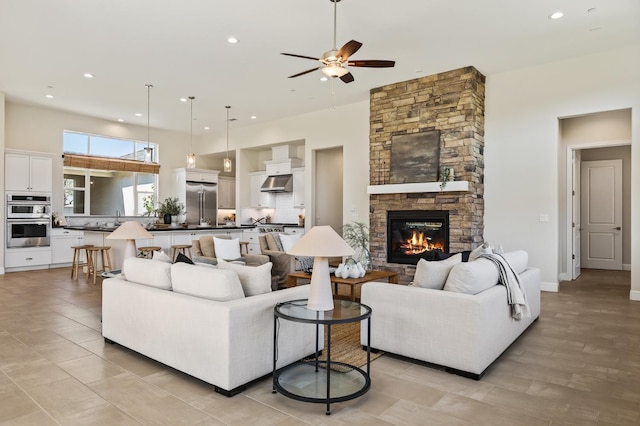 998 Highland Rd W, Madera, CA 93636 - living room with a ceiling fan, recessed lighting, a fireplace, and a high ceiling