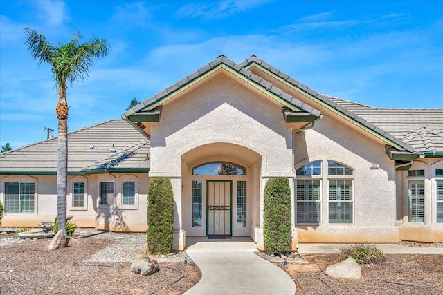 431 S Fowler Ave, Fresno, CA 93727 - property entrance with a tiled roof and stucco siding