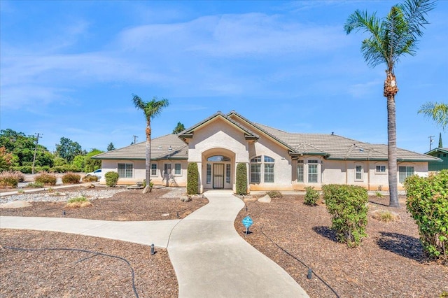 431 S Fowler Ave, Fresno, CA 93727 - view of front of house with stucco siding and a tile roof