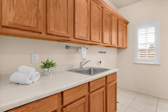 431 S Fowler Ave, Fresno, CA 93727 - washroom featuring cabinet space, washer hookup, and light tile patterned floors