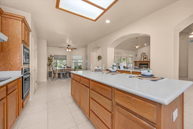 431 S Fowler Ave, Fresno, CA 93727 - kitchen featuring ceiling fan, appliances with stainless steel finishes, open floor plan, light countertops, and recessed lighting