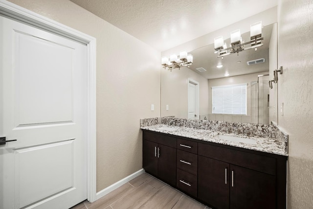 503 Cathedral Ct S, Madera, CA 93636 - full bathroom with double vanity and wood finished floors