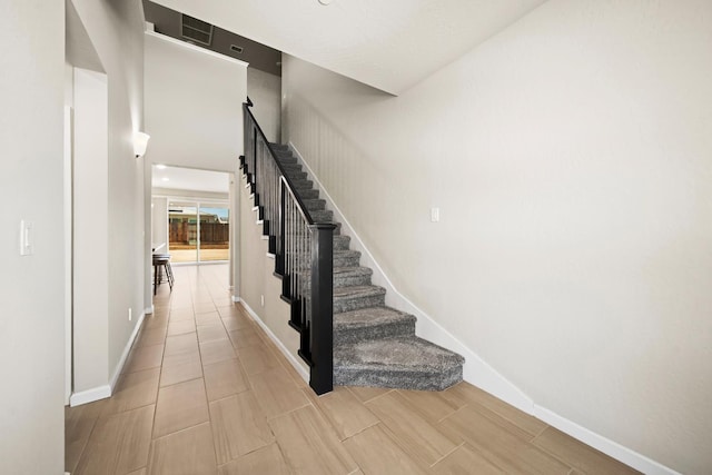 503 Cathedral Ct S, Madera, CA 93636 - stairway featuring baseboards and wood tiled floors