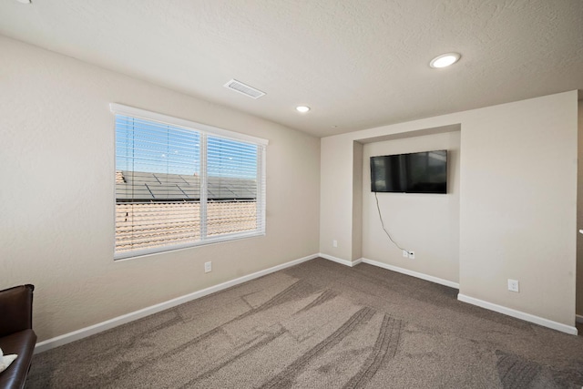 503 Cathedral Ct S, Madera, CA 93636 - spare room with carpet, a textured ceiling, and recessed lighting