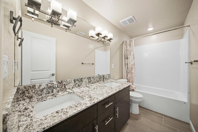 503 Cathedral Ct S, Madera, CA 93636 - bathroom featuring double vanity and shower / bath combo with shower curtain