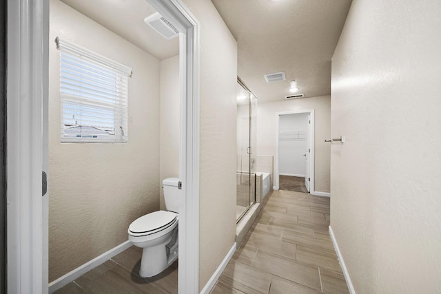 503 Cathedral Ct S, Madera, CA 93636 - full bathroom with a shower stall, wood tiled floors, and a walk in closet