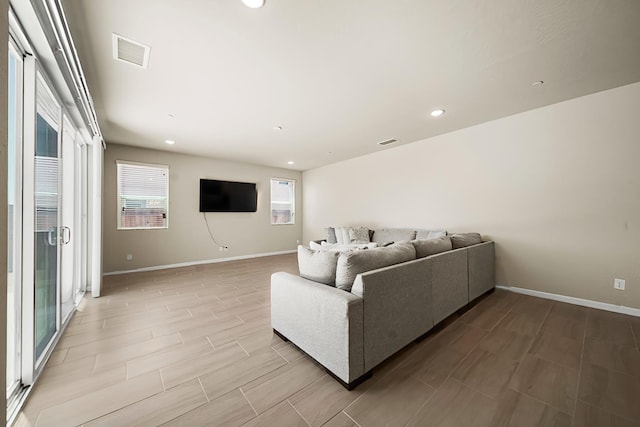 503 Cathedral Ct S, Madera, CA 93636 - living room featuring healthy amount of natural light, recessed lighting, and wood finish floors