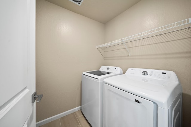 503 Cathedral Ct S, Madera, CA 93636 - laundry area featuring washing machine and dryer and baseboards