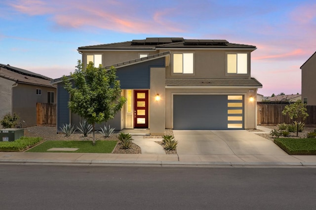 503 Cathedral Ct S, Madera, CA 93636 - view of front of house featuring driveway, solar panels, a garage, and stucco siding