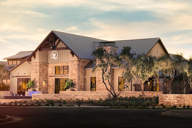 503 Cathedral Ct S, Madera, CA 93636 - view of front of property featuring a standing seam roof, a metal roof, and stone siding