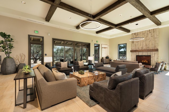 503 Cathedral Ct S, Madera, CA 93636 - living room featuring coffered ceiling, healthy amount of natural light, beamed ceiling, and a fireplace