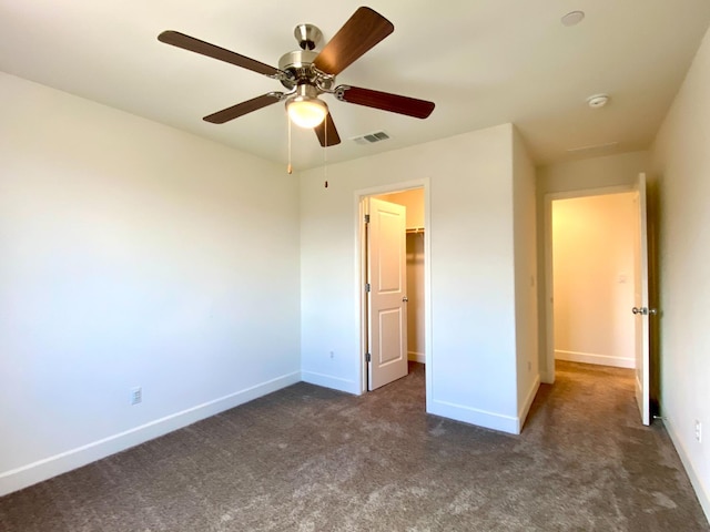 578 S Alpine Way S, Madera, CA 93636 - unfurnished bedroom featuring carpet flooring, a spacious closet, and ceiling fan
