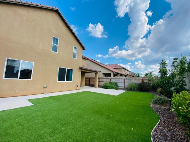 578 S Alpine Way S, Madera, CA 93636 - rear view of house with stucco siding, a fenced backyard, and a patio area