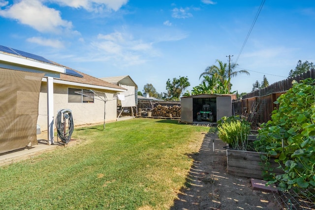 11736 Waverly Rd, Madera, CA 93636 - fenced backyard featuring a storage unit and a vegetable garden