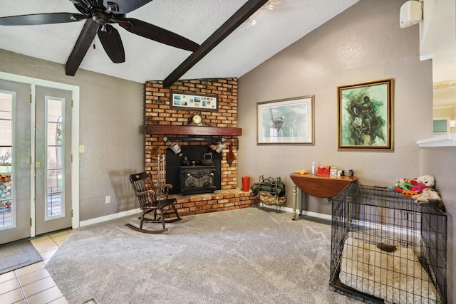 11736 Waverly Rd, Madera, CA 93636 - living area with a ceiling fan, a textured ceiling, tile patterned flooring, and a fireplace