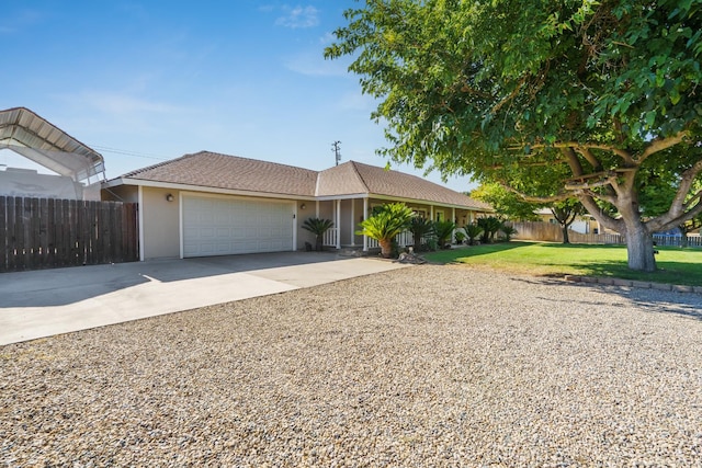11736 Waverly Rd, Madera, CA 93636 - ranch-style house featuring concrete driveway, a garage, and stucco siding