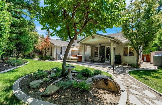 4632 W Minarets Ave, Fresno, CA 93722 - view of front facade featuring ceiling fan, stucco siding, a tile roof, and a patio