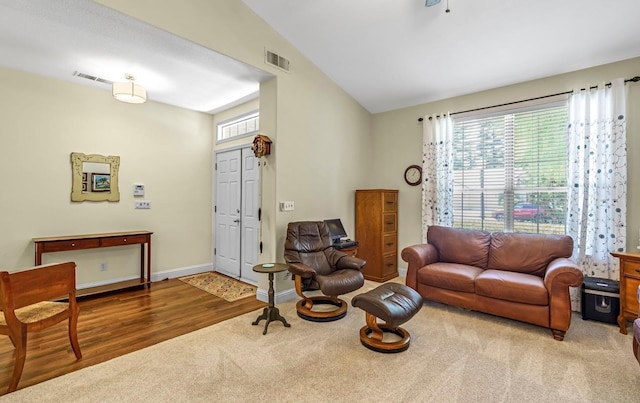 4632 W Minarets Ave, Fresno, CA 93722 - carpeted living room with lofted ceiling and wood finished floors