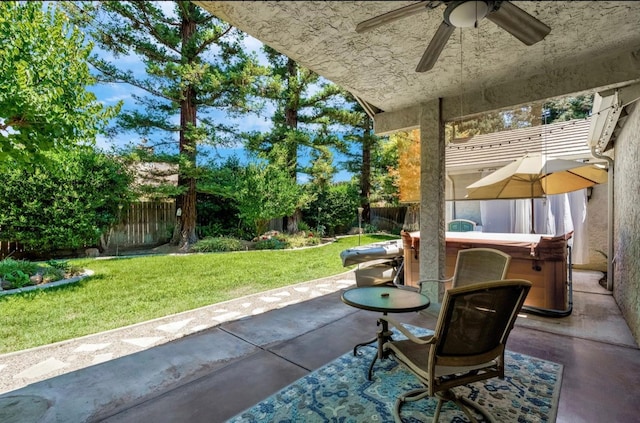 4632 W Minarets Ave, Fresno, CA 93722 - fenced backyard featuring a ceiling fan, a patio, and a hot tub
